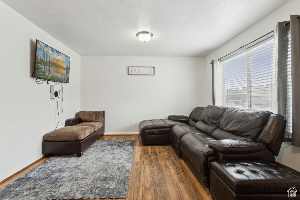 Living room featuring wood finished floors and baseboards