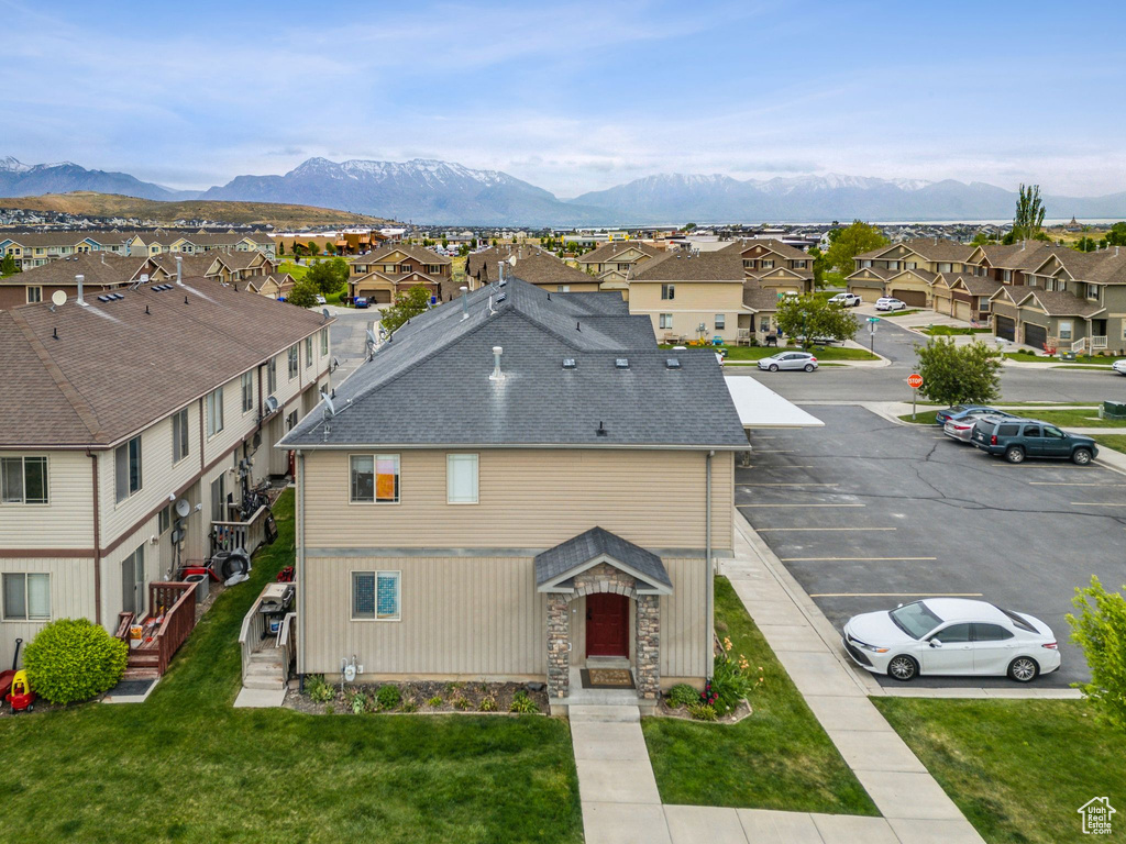 Aerial view of residential area featuring mountains