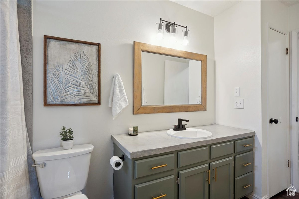 Full bathroom featuring vanity and toilet