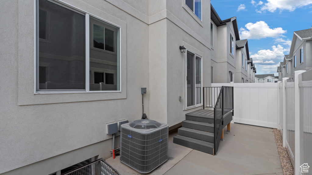 View of patio with central air condition unit