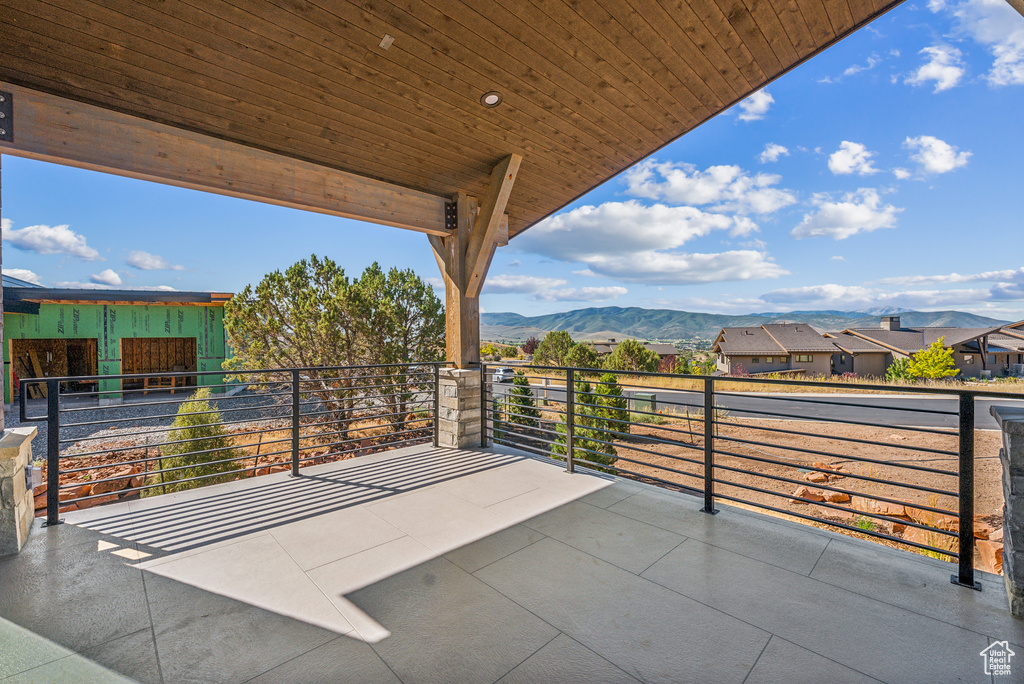 View of patio / terrace featuring a mountain view and a residential view