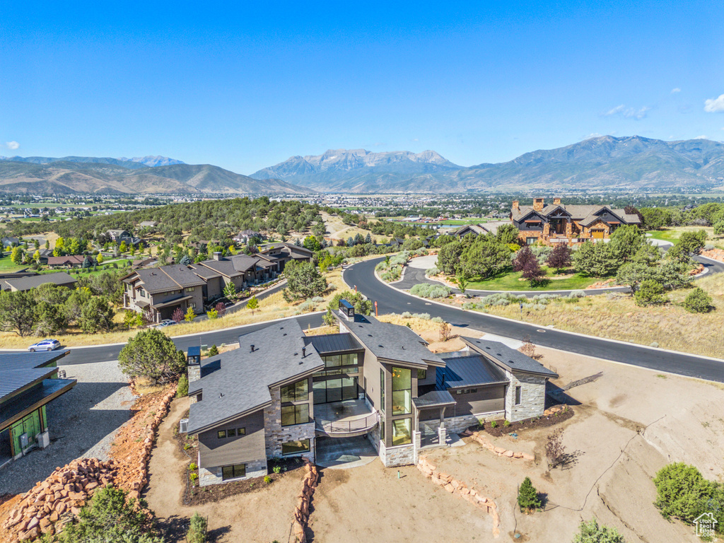 Aerial view of residential area featuring mountains