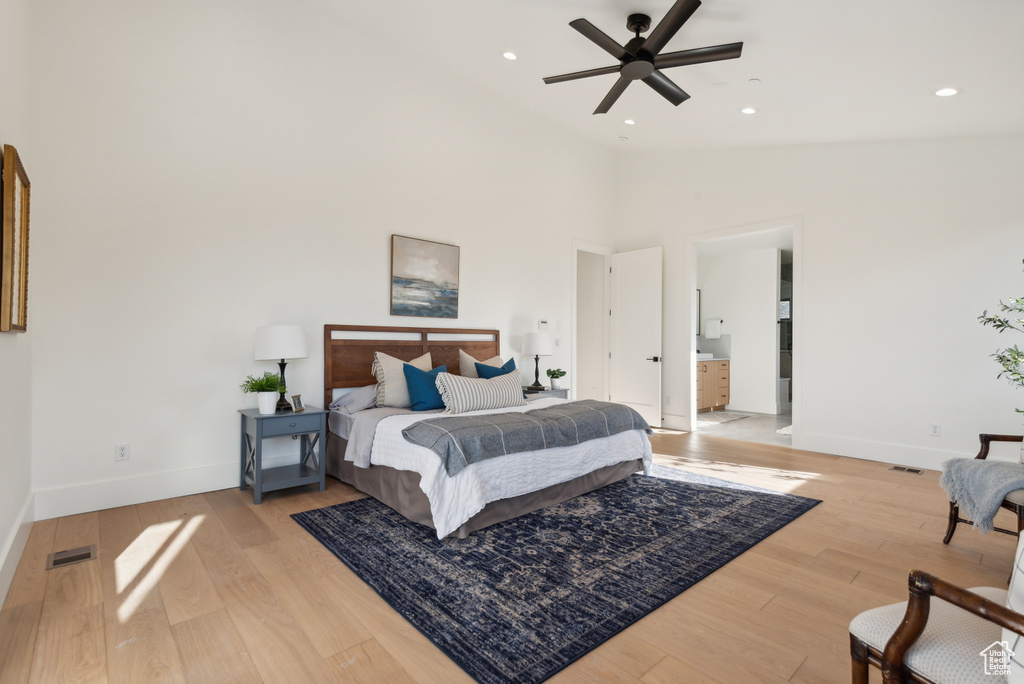 Bedroom with baseboards, lofted ceiling, light wood finished floors, recessed lighting, and a ceiling fan