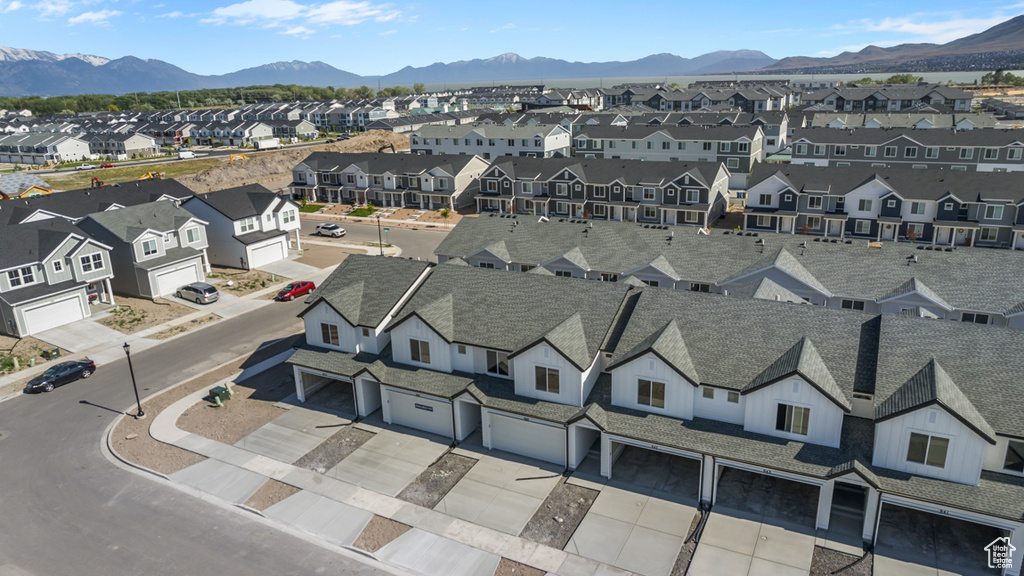 Aerial view of residential area featuring a mountainous background