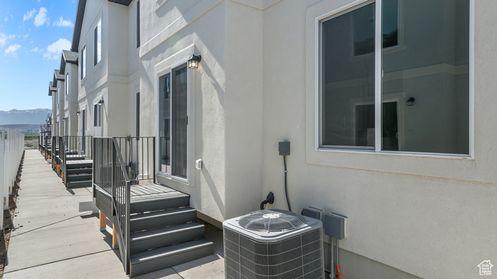 View of patio / terrace with central AC unit and a mountain view