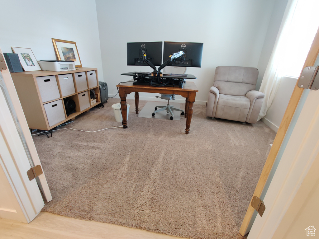 Office featuring baseboards and light colored carpet