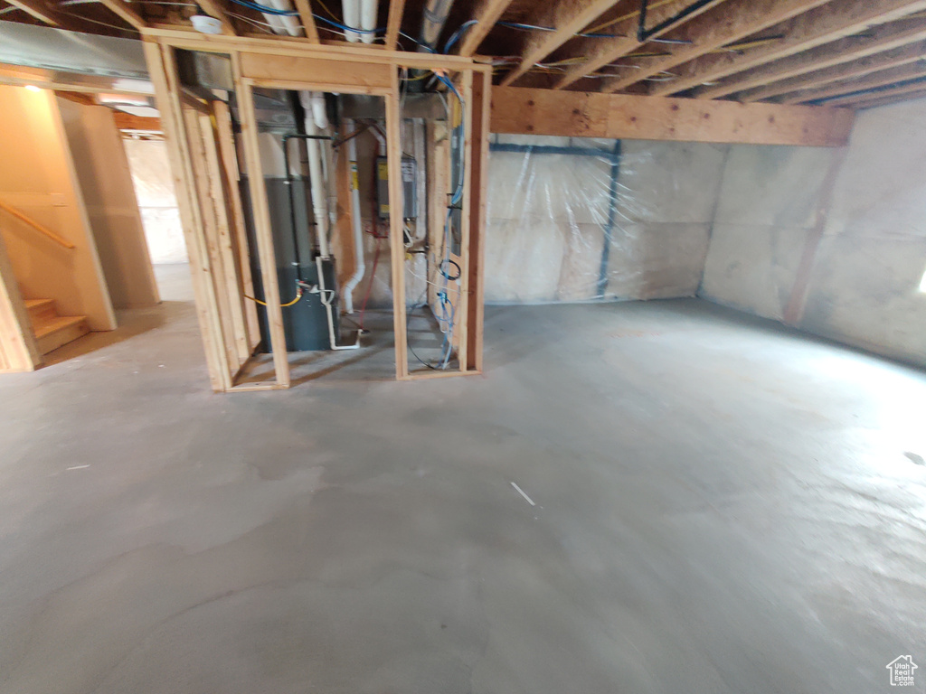 Unfinished basement featuring stairs