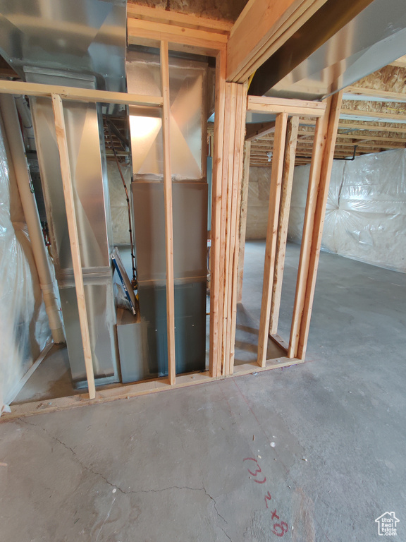 Misc room featuring unfinished concrete flooring