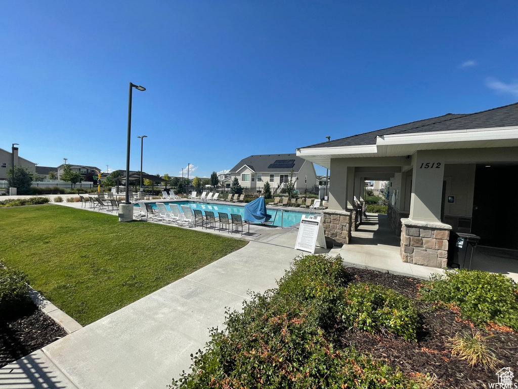 Community pool featuring a patio