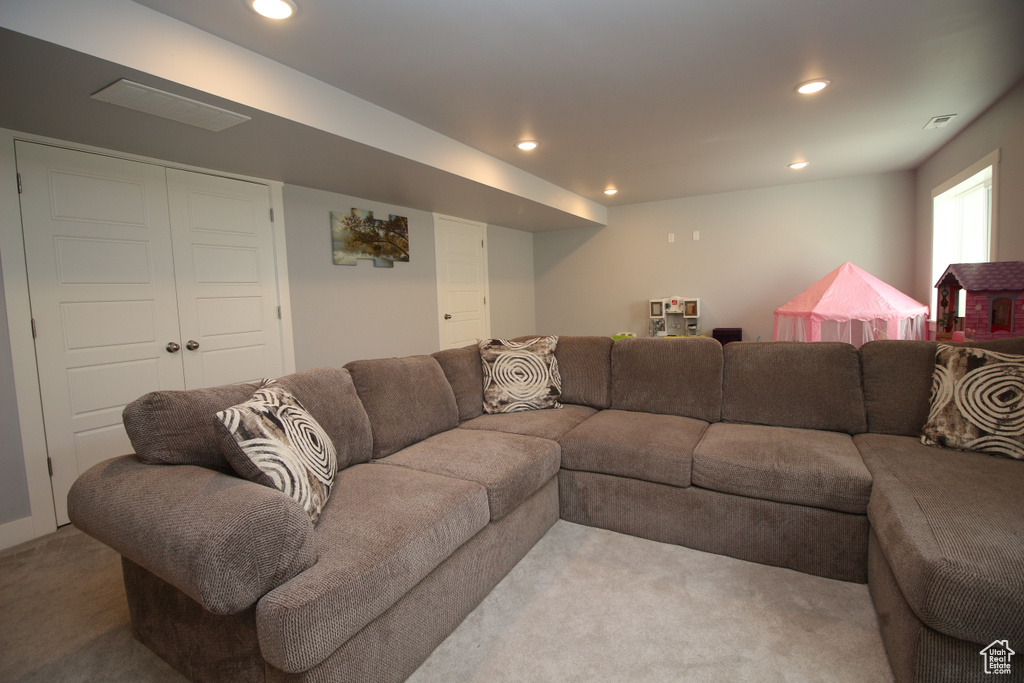 Living area featuring carpet flooring and recessed lighting
