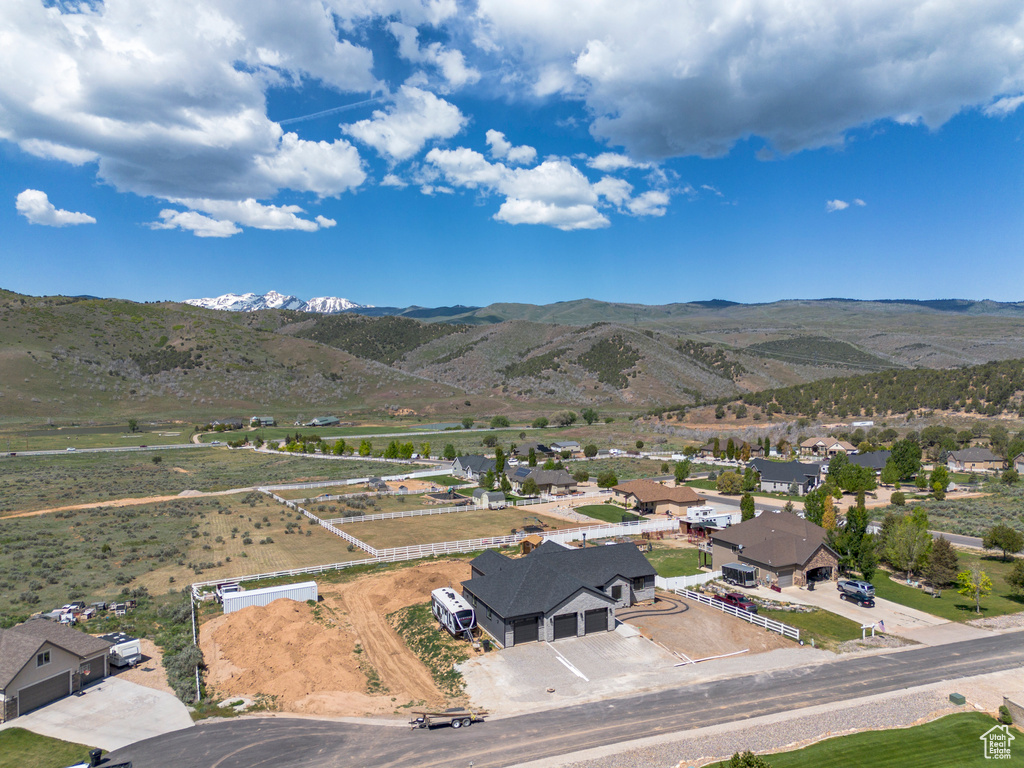 Aerial view of residential area featuring mountains