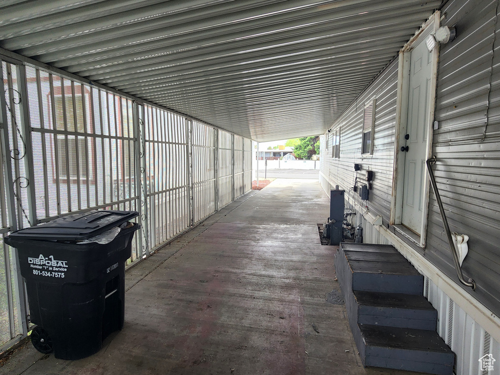 View of patio with a carport