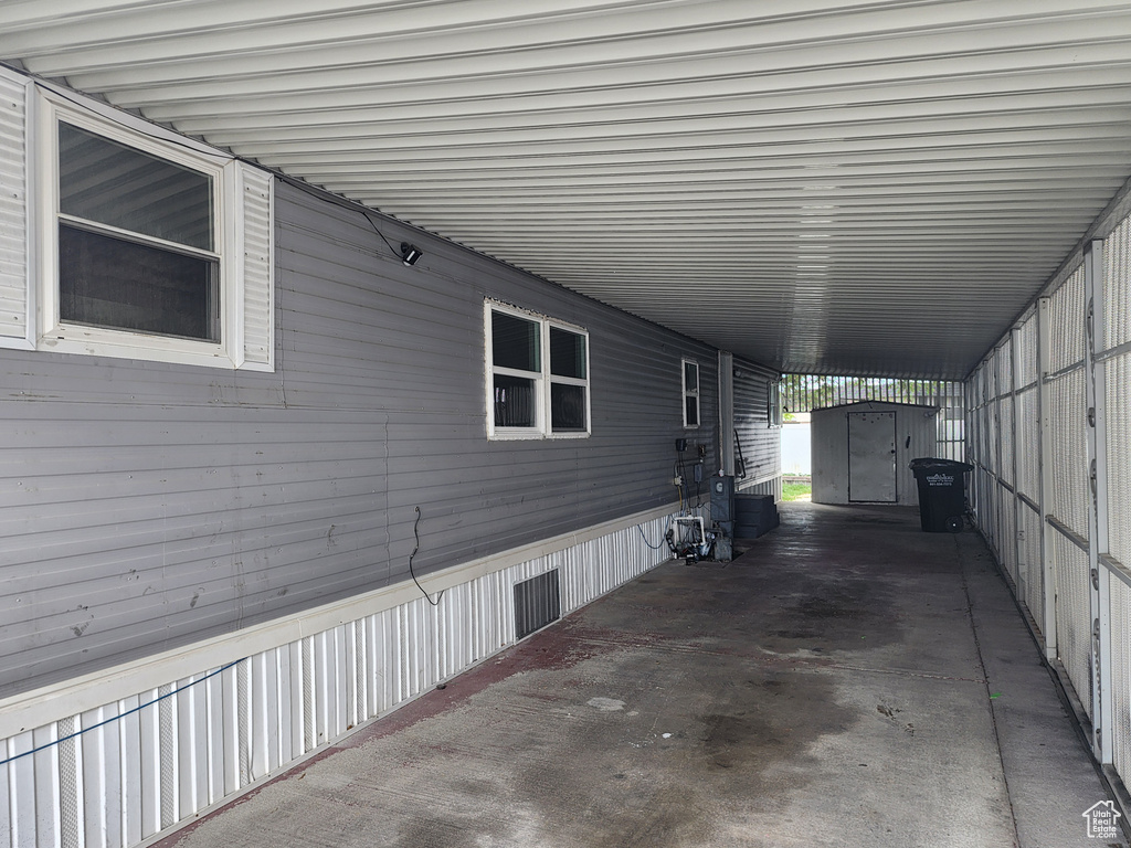 View of patio / terrace featuring a carport
