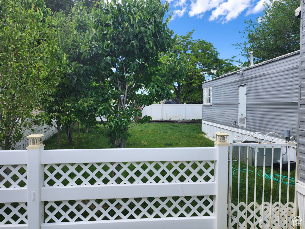 View of yard featuring a gate