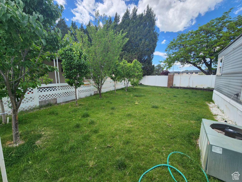 View of yard with central AC
