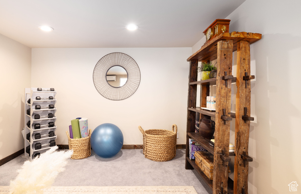 Exercise room featuring carpet floors, baseboards, and recessed lighting