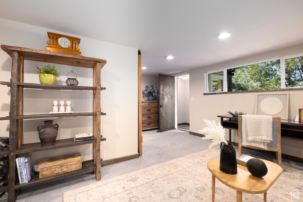 Living area featuring baseboards, carpet floors, and recessed lighting