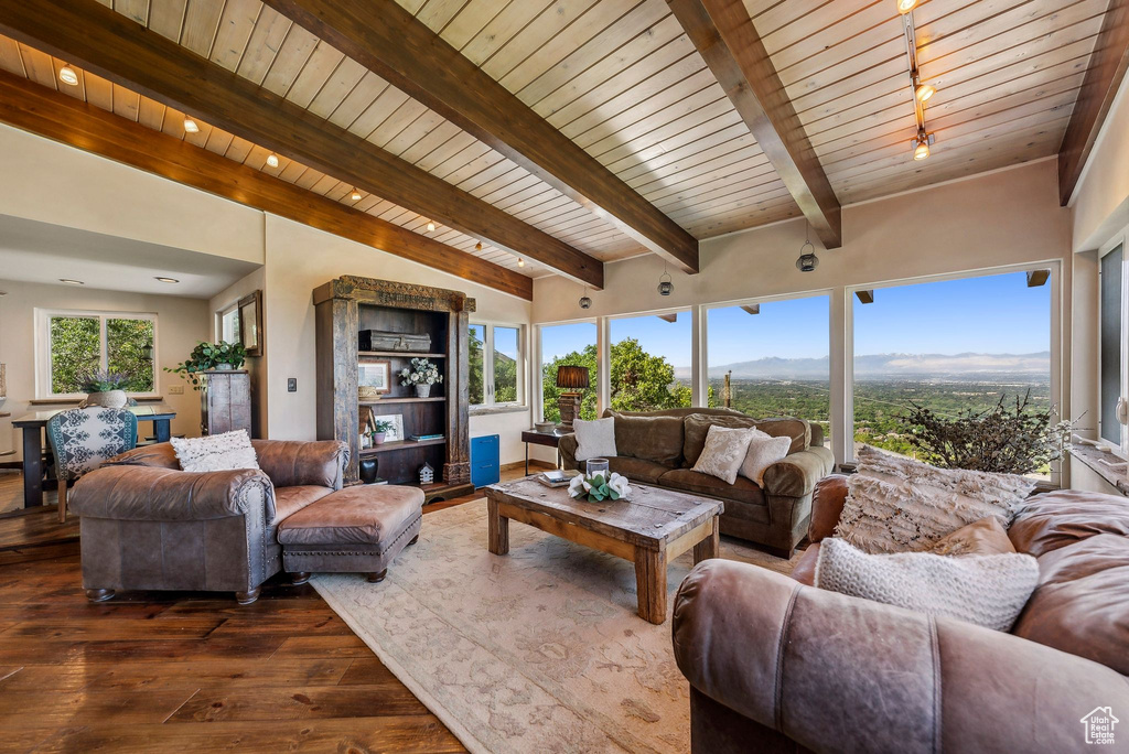Living room featuring wooden ceiling and dark wood-style flooring