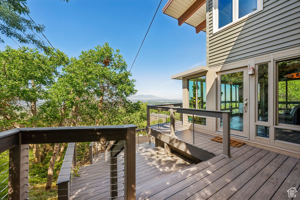 Wooden deck featuring a mountain view