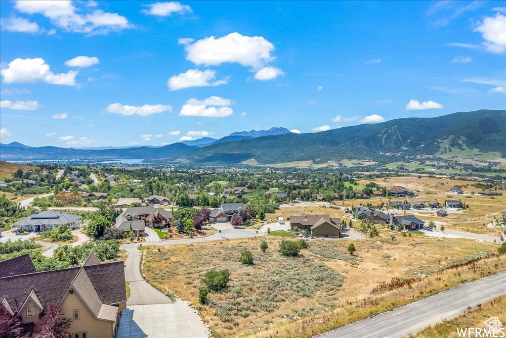 View of mountain background featuring nearby suburban area