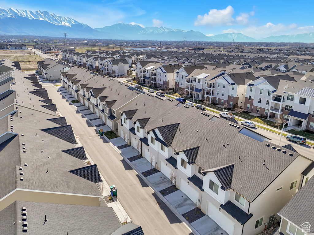 Aerial perspective of suburban area featuring a mountain backdrop