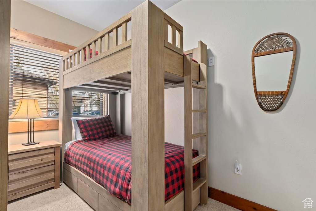Bedroom with carpet flooring and baseboards
