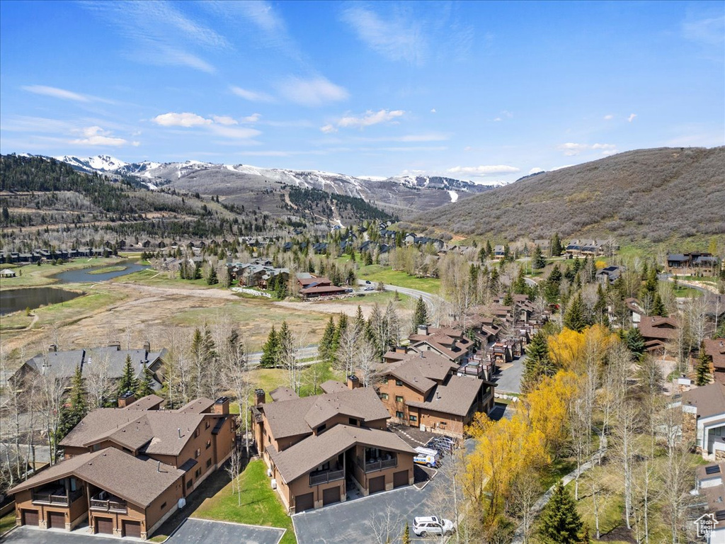 View of property location with nearby suburban area and a water and mountain view