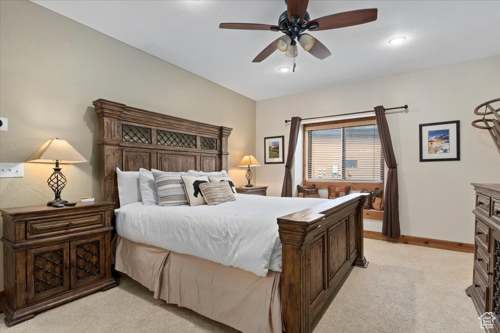 Bedroom with light carpet, baseboards, ceiling fan, and recessed lighting
