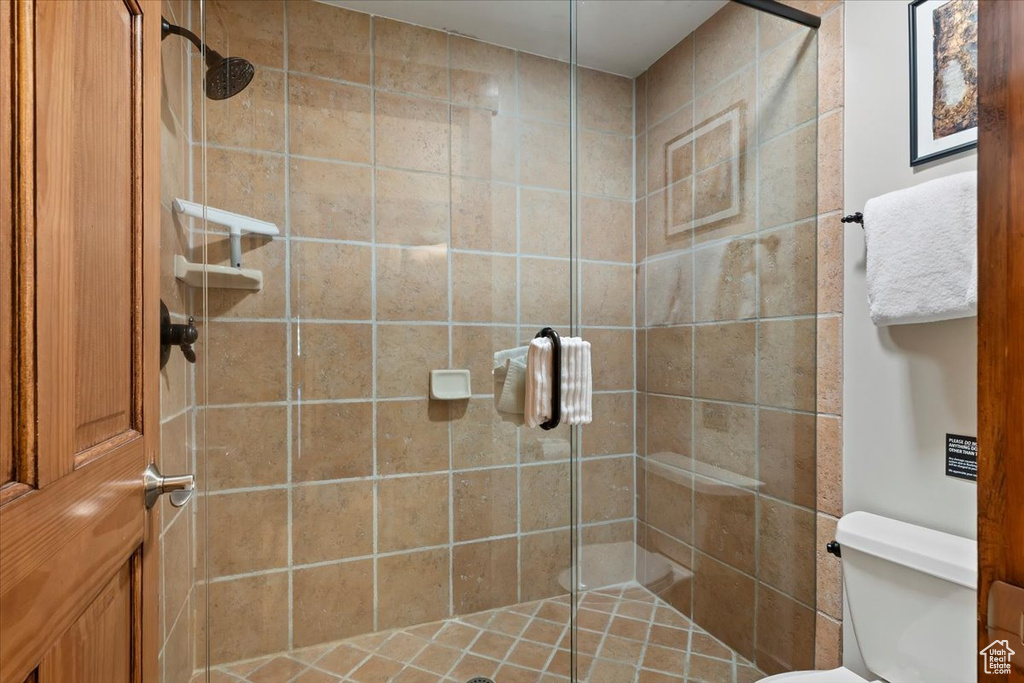 Full bath with a stall shower and toilet