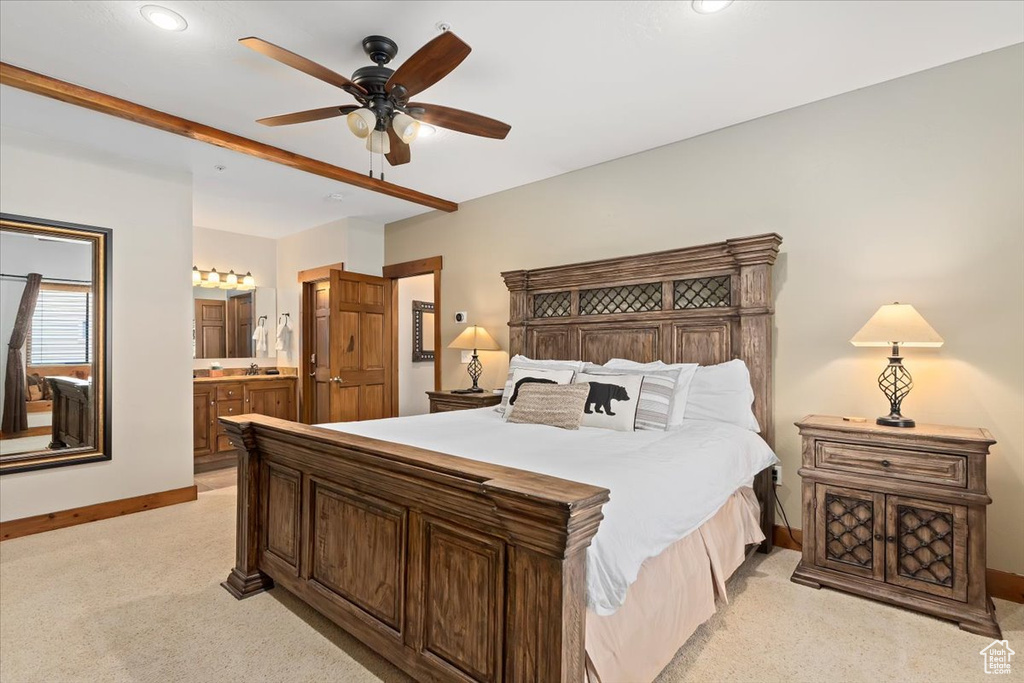 Bedroom featuring baseboards, light carpet, ensuite bathroom, recessed lighting, and ceiling fan