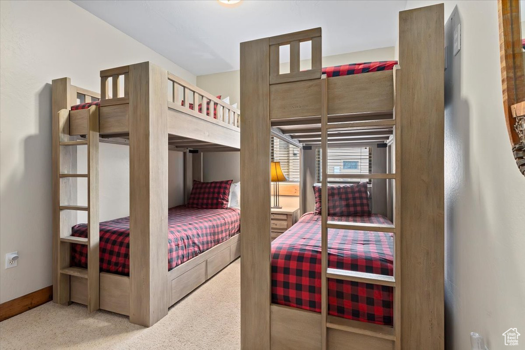 Bedroom with carpet flooring and baseboards