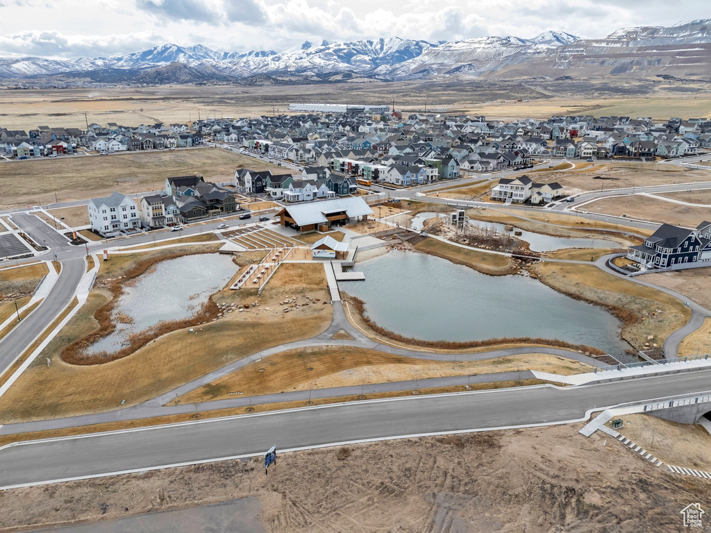 Aerial perspective of suburban area featuring a water and mountain view