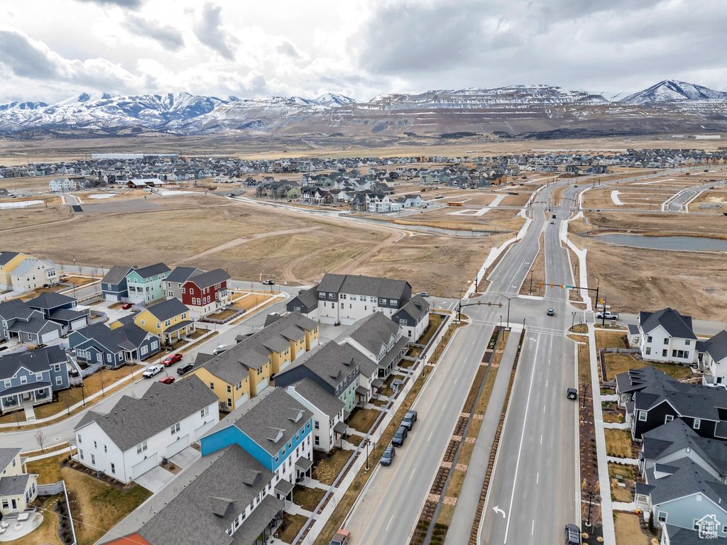 Aerial perspective of suburban area with a mountain backdrop