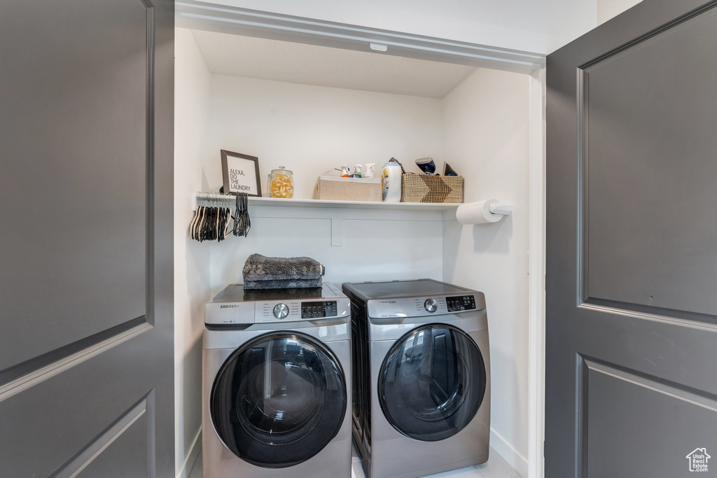 Laundry area featuring separate washer and dryer