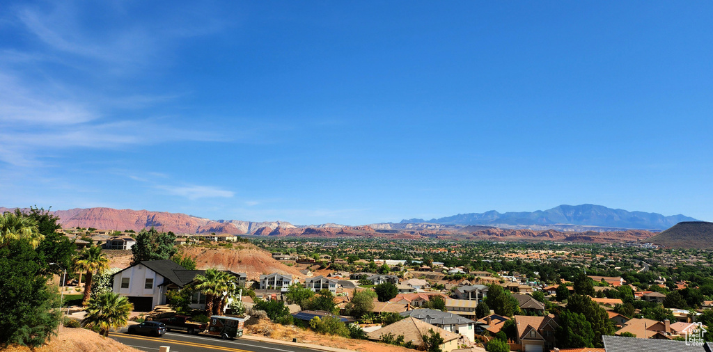 View of mountain background featuring nearby suburban area