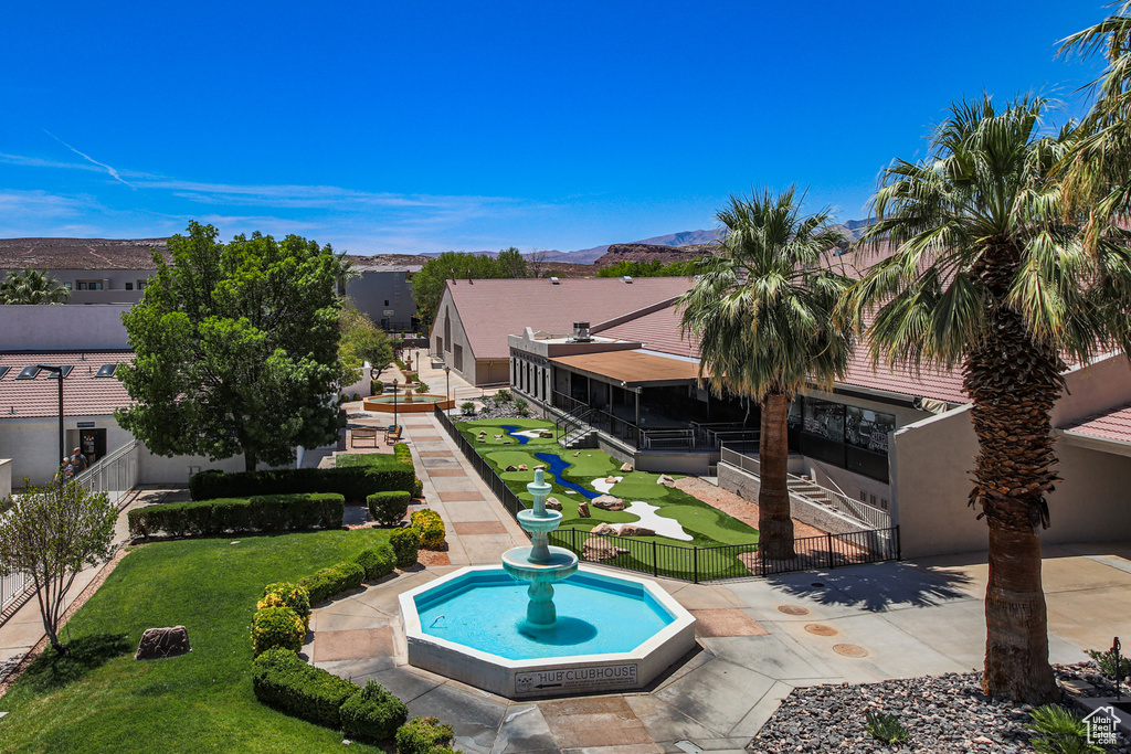 View of pool featuring a mountain view and a patio