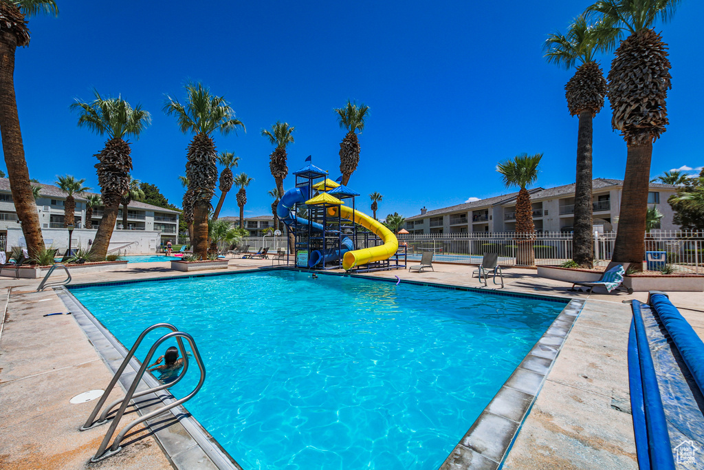 Community pool featuring a patio