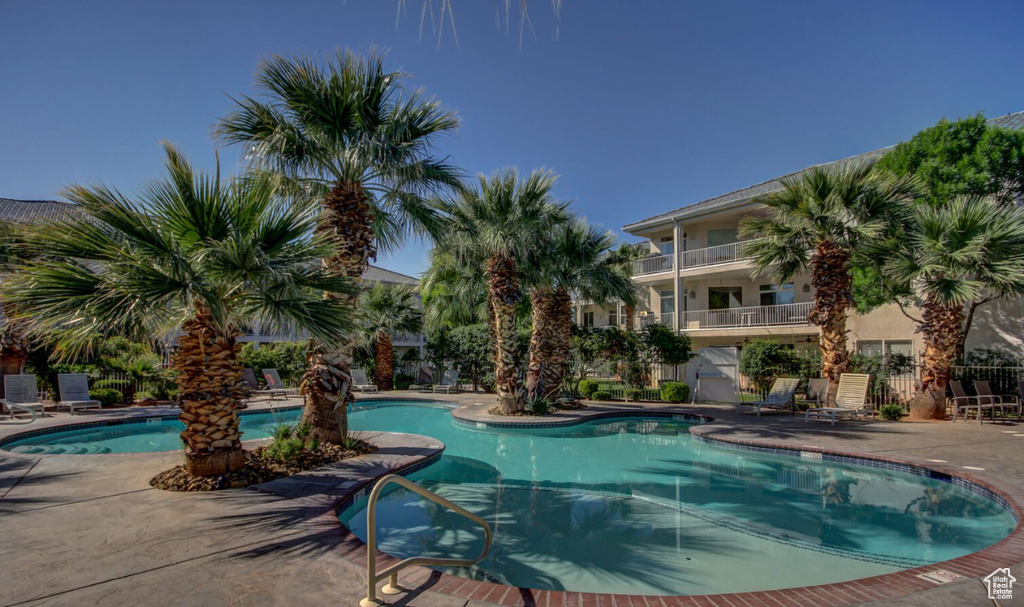 Community pool featuring a patio