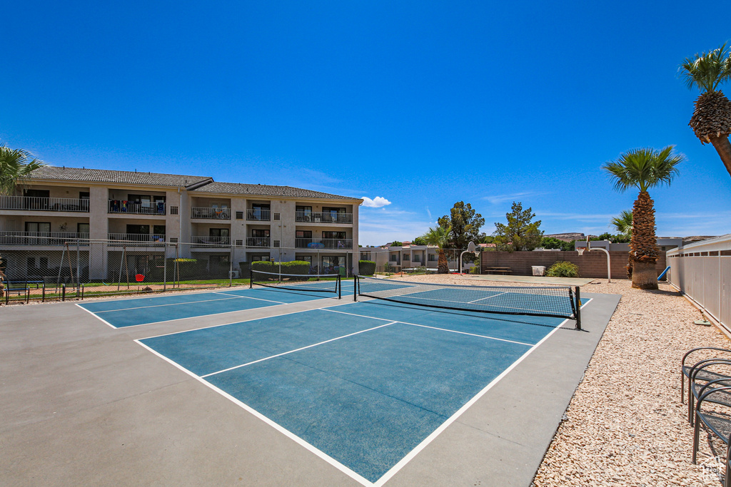 View of tennis court featuring community basketball court