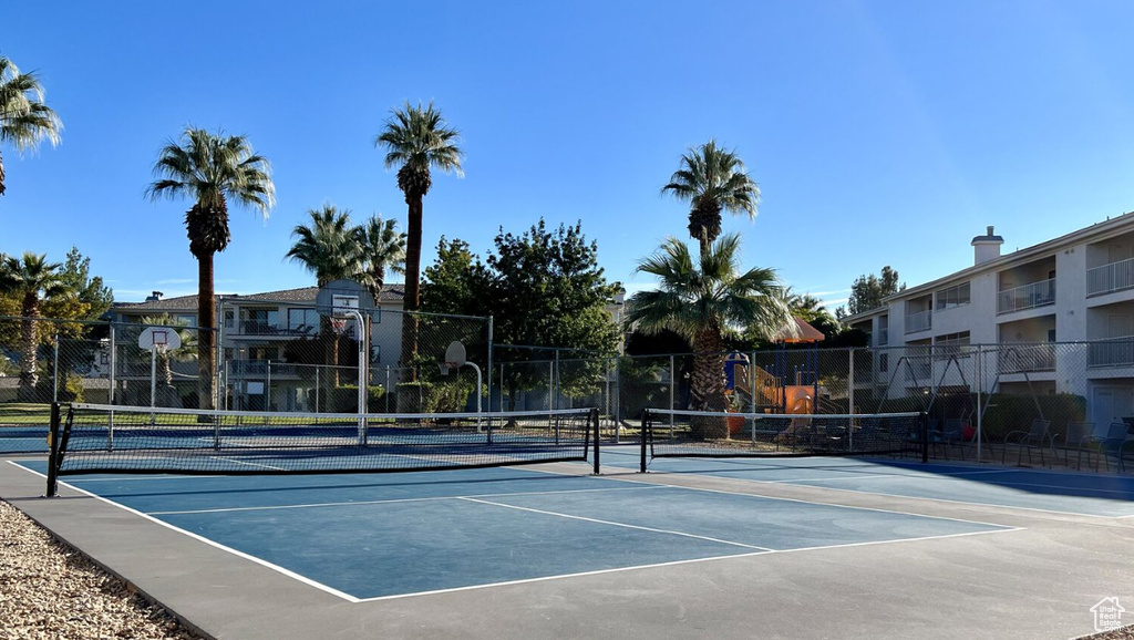View of tennis court with community basketball court