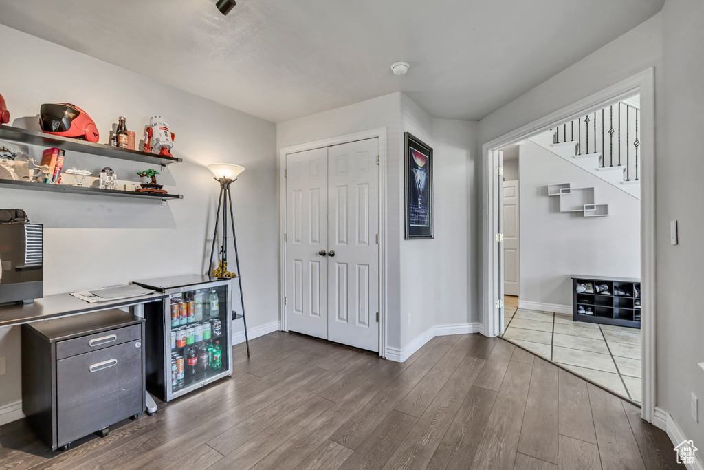 Office space with wood finished floors and baseboards