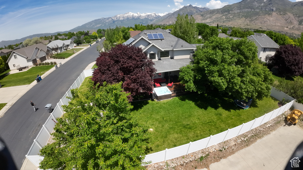 Aerial perspective of suburban area with a mountainous background