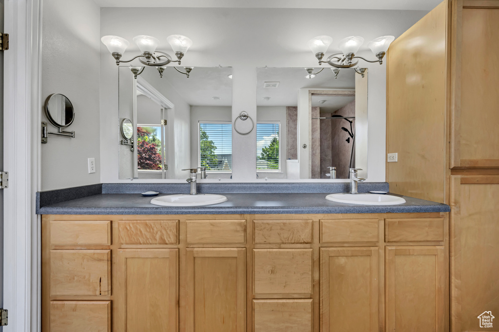 Bathroom with double vanity and a shower