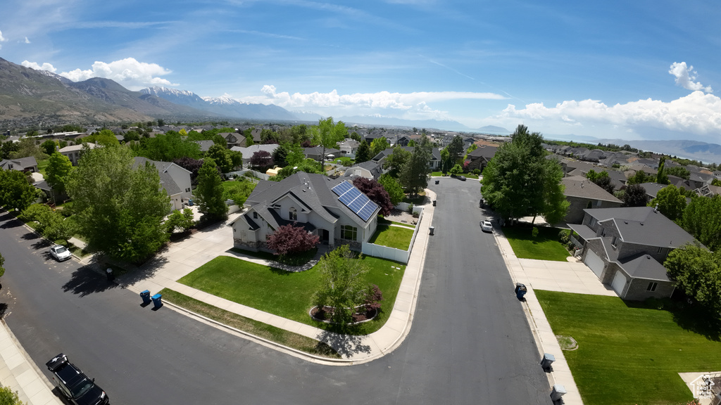 Aerial view of residential area featuring a mountain backdrop