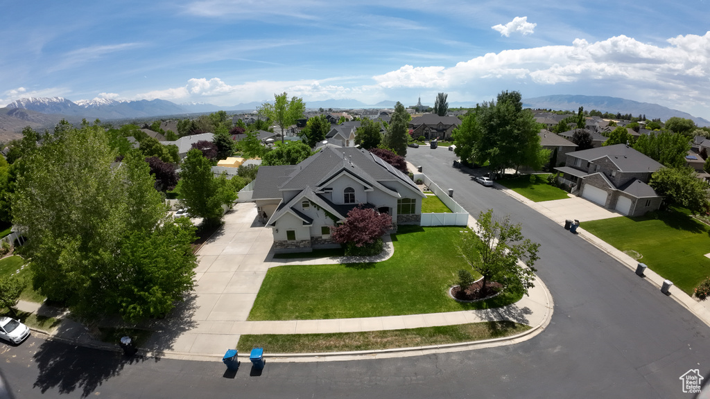 Aerial perspective of suburban area featuring a mountainous background