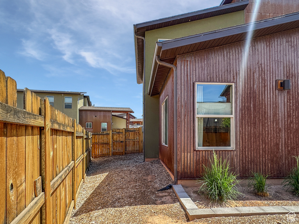 View of property exterior with a fenced backyard