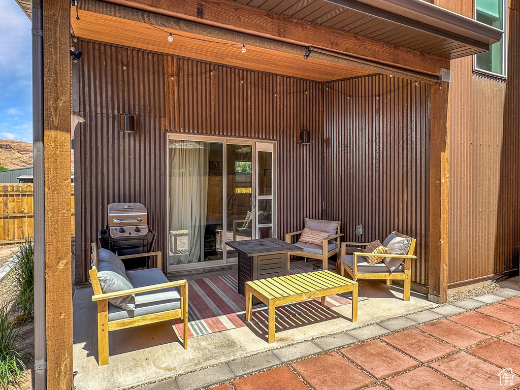 View of patio with an outdoor hangout area