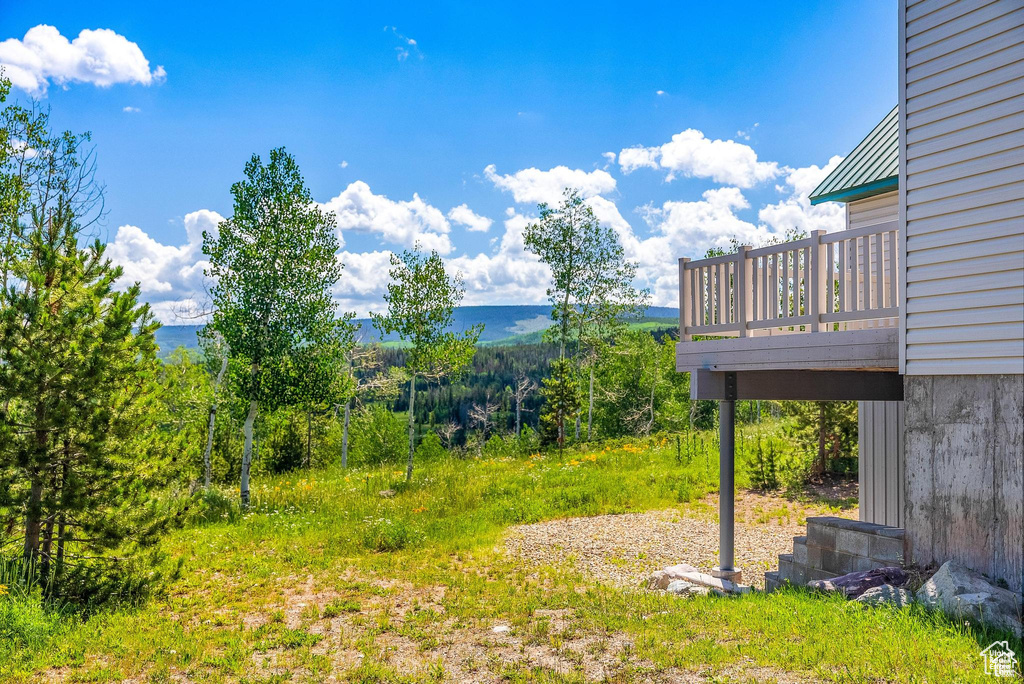 View of yard featuring a wooden deck