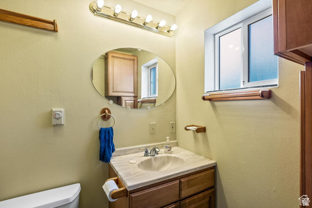 Bathroom with vanity and toilet