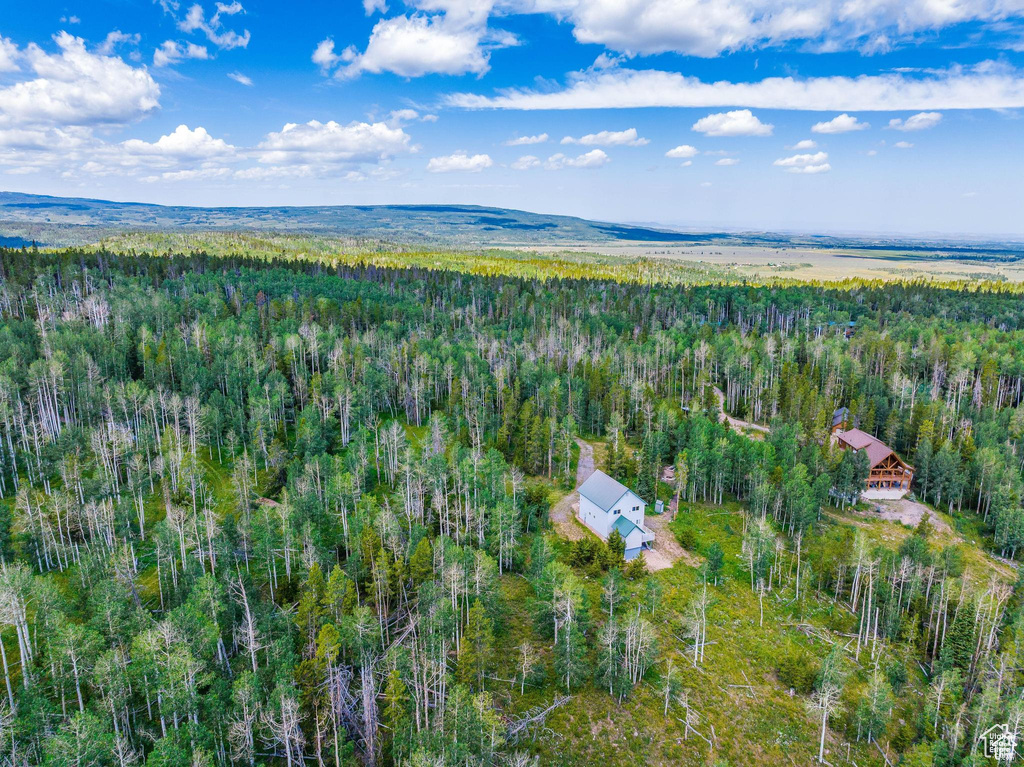 View of property location featuring a heavily wooded area